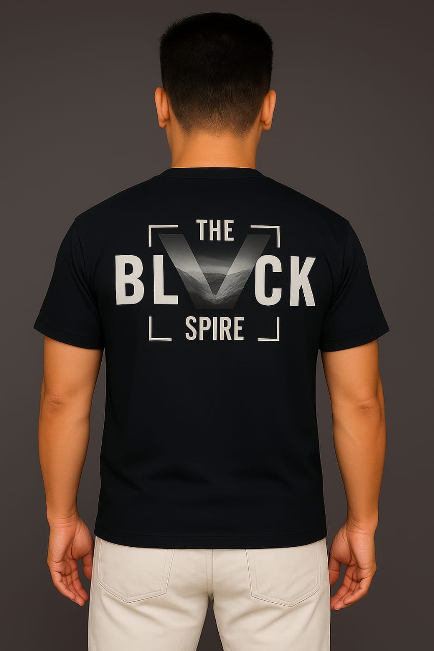 Back view of a black T-shirt showcasing 'THE BLACK SPIRE' in striking typography, from My Store. The shirt symbolizes strength and elevation, fitting for bold streetwear.