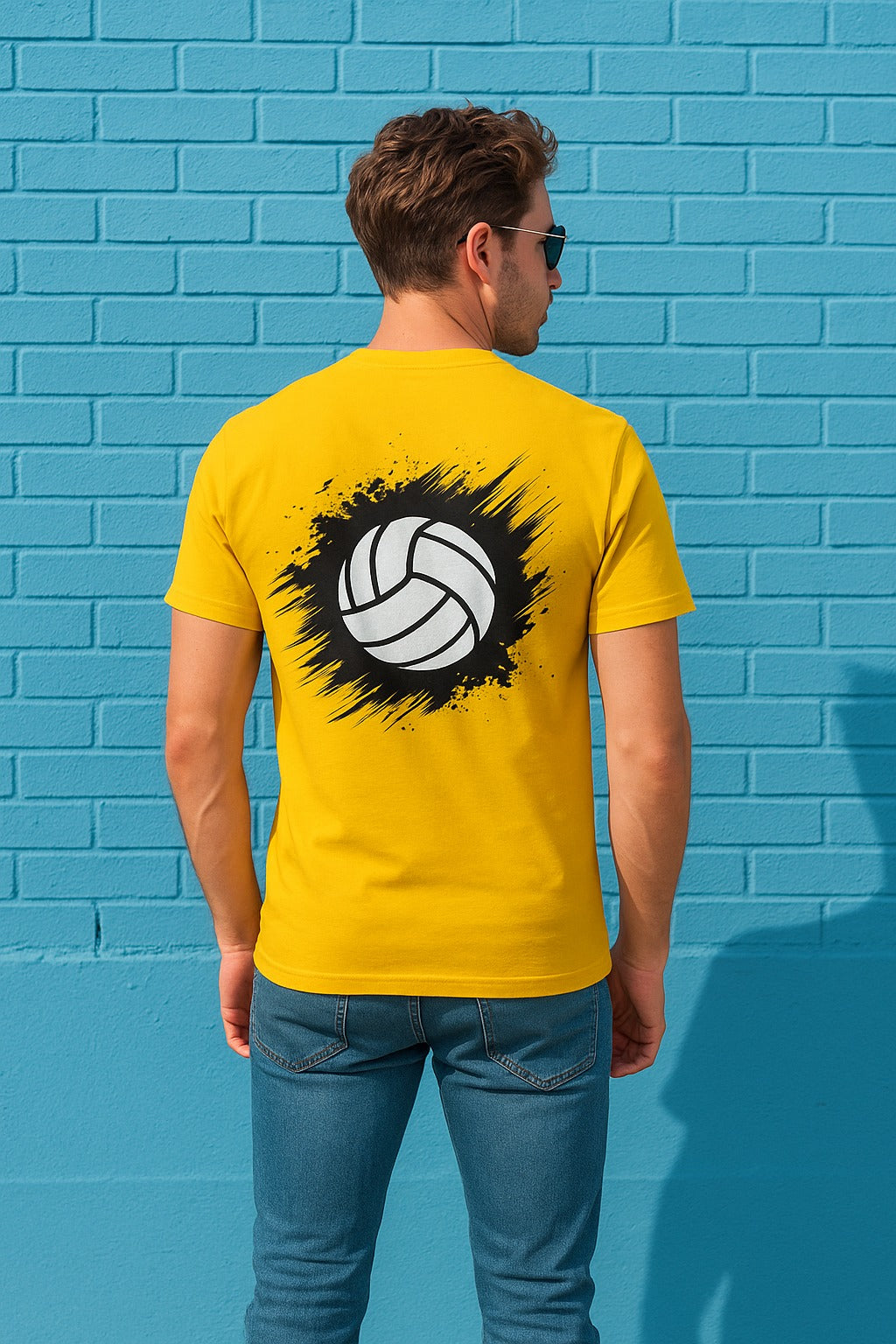 Back view of a yellow t-shirt featuring a dynamic volleyball graphic, designed by HAUMIS, showcasing a stylish athletic design.