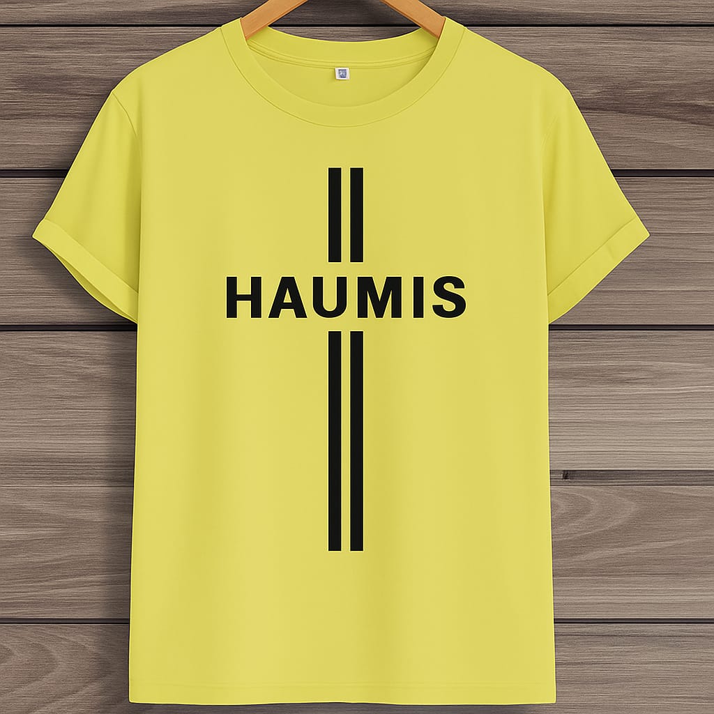 HAUMIS Sand Stripe T-Shirt in bright yellow on a wooden background, emphasizing the bold black typography and minimalist design.
