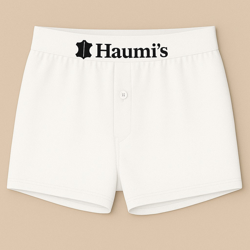 Fresh white underwear from HAUMIS displaying a clear 'Haumi's' logo on the waistband.